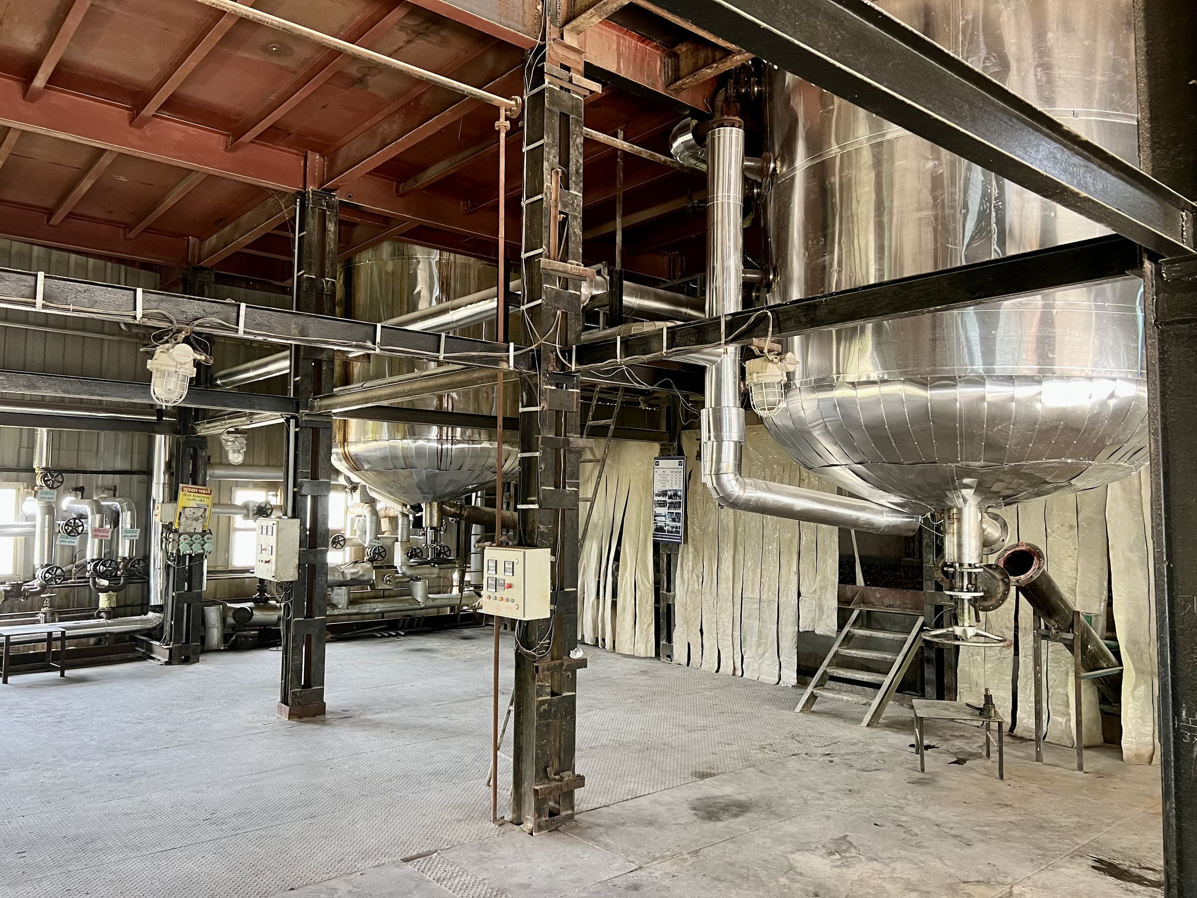 Insulated resin reactor vessels and overhead pipework in the resin plant